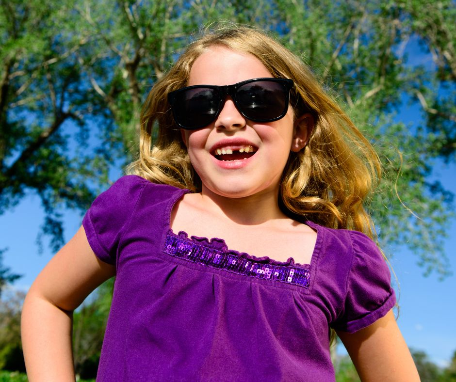 girl smiling with missing tooth