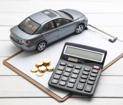 Car and Calculator on Clipboard